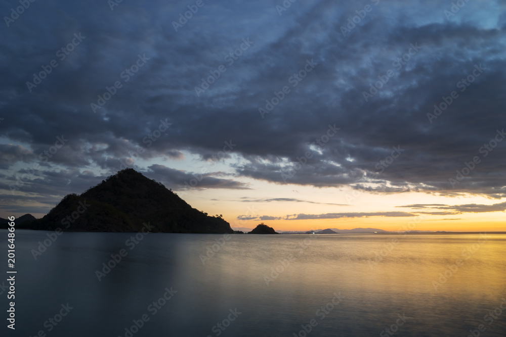 Beautiful seascape with hills at sunrise time