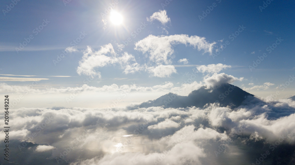 Beautiful blue sky with sun above Kintamani mountain