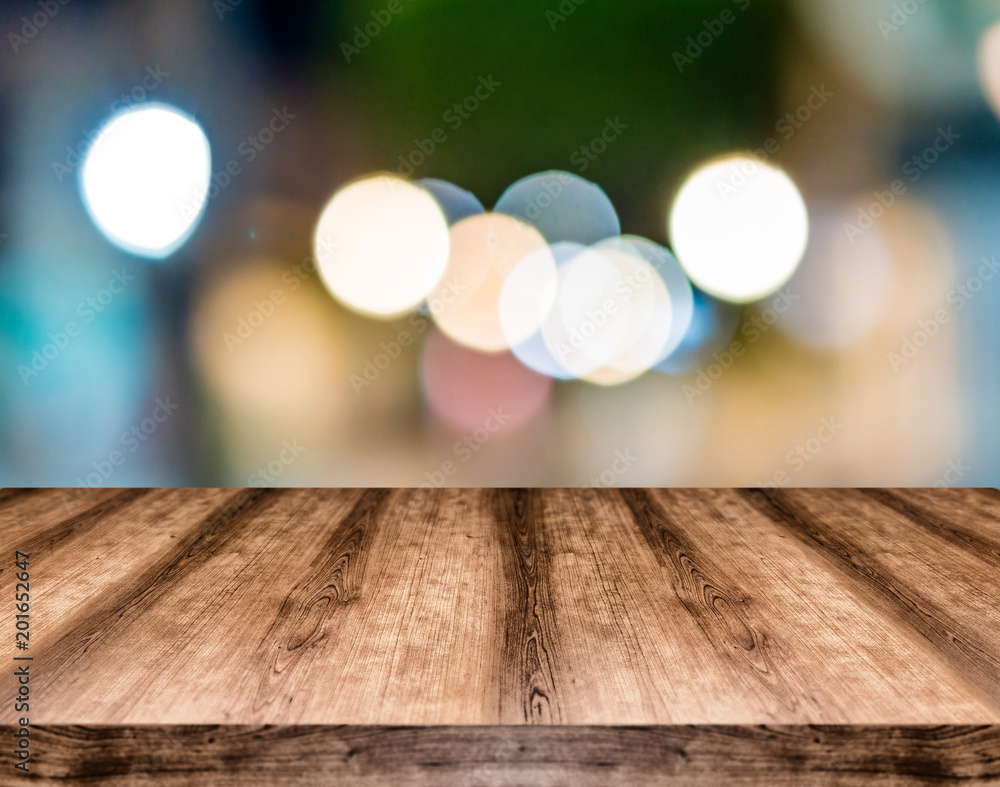 Wooden empty table board in front of blurred background. Can be used for display or montage any product. Mock up for display your product.