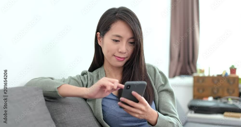 Housewife of using smart phone at home Housewife of using smart phone at home