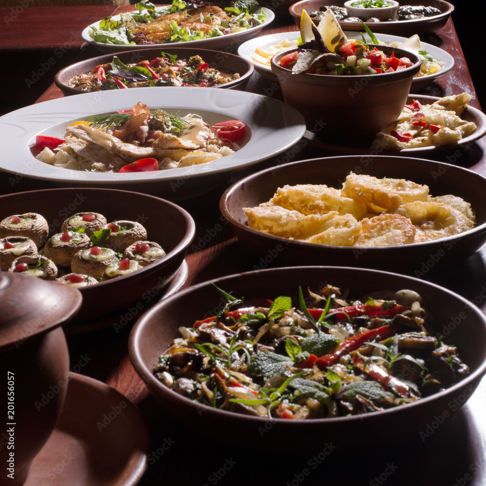 Assorted oriental food set. Armenian,Georgian cuisine dishes on table.Food party.