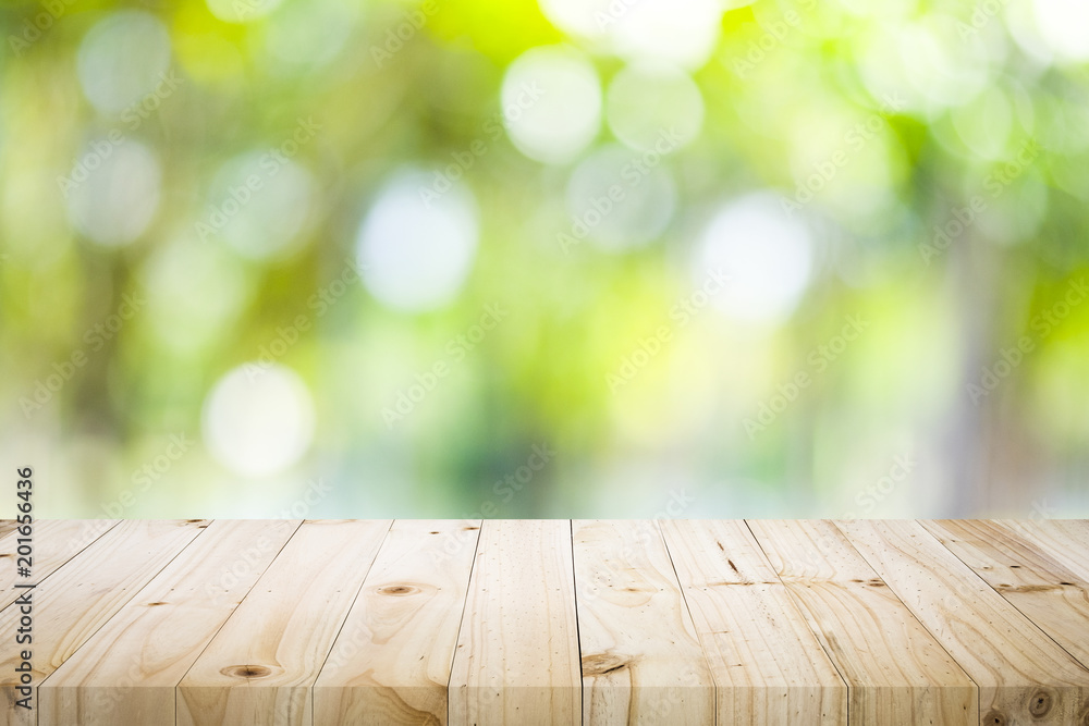 Wooden table with blur background of nature forest. Wooden table with blur background of nature forest.