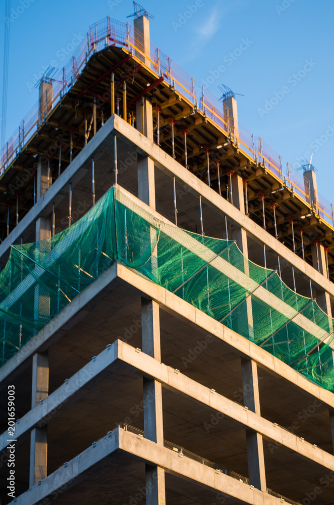 Fototapeta premium View of building being built, low angle view