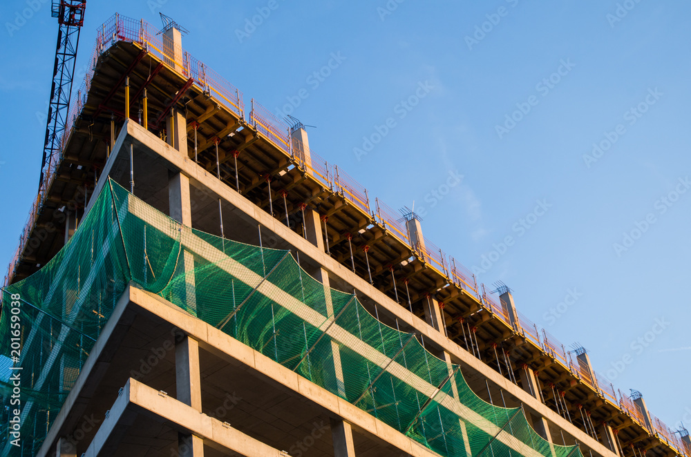 Fototapeta premium View of building being built, low angle view
