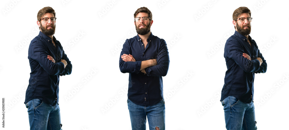 Young man with beard with crossed arms confident and happy with a big natural smile laughing isolated over white background