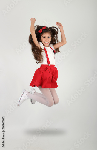 Happy an Successful Child Girl is Jumping