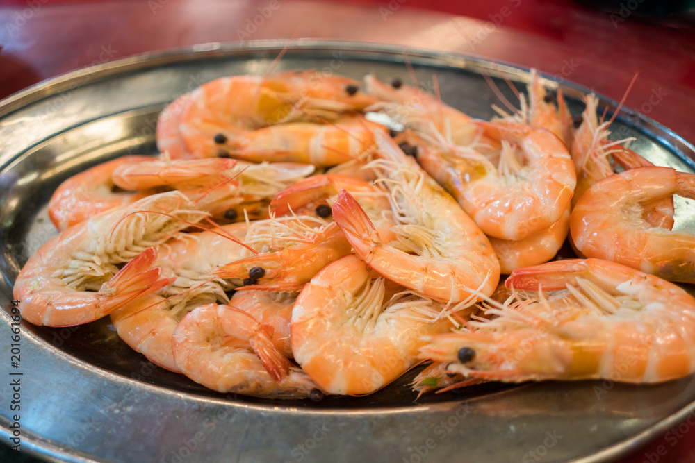 A plate of delicious and fresh stirfried king prawns.