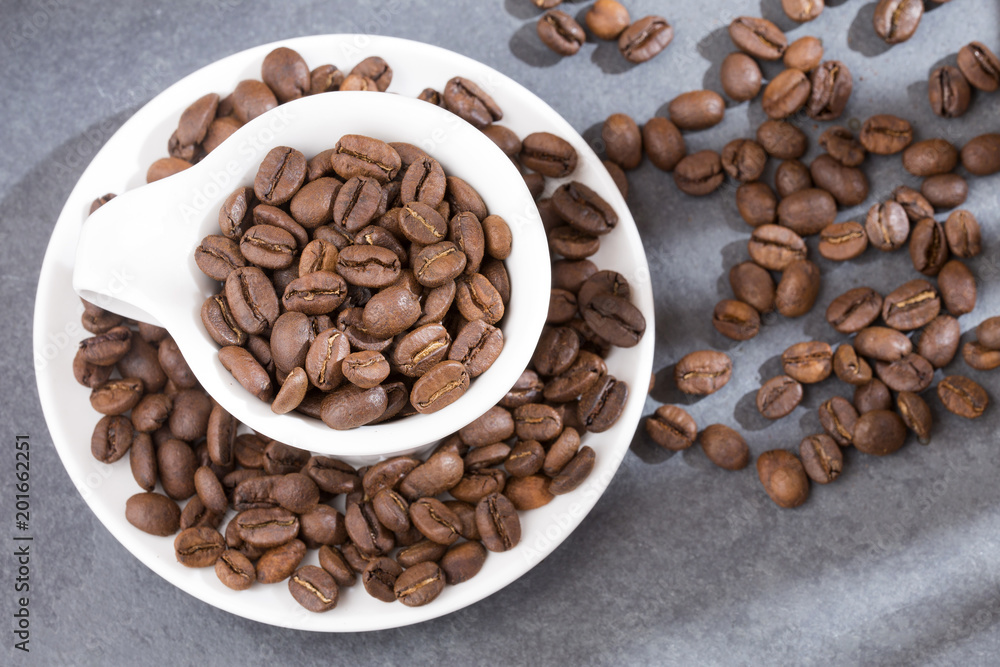 Roasted coffee on the wooden background - Coffea Roasted coffee on the wooden background - Coffea