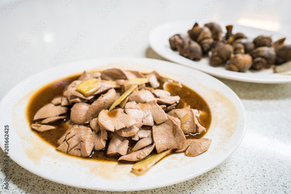 A plate of stir fry pig kidney with ginger and wine. A plate of stir fry pig kidney with ginger and wine.