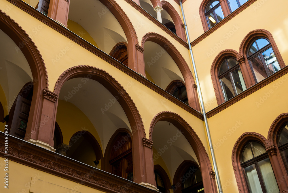part of an old building from the courtyard with arched balconies