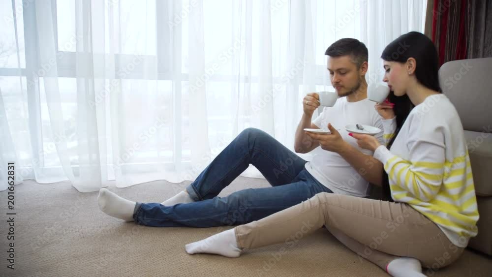 family couple leisure. communication. relaxing time. man and woman drinking tea or coffee at home family couple leisure. communication. relaxing time. man and woman drinking tea or coffee at home