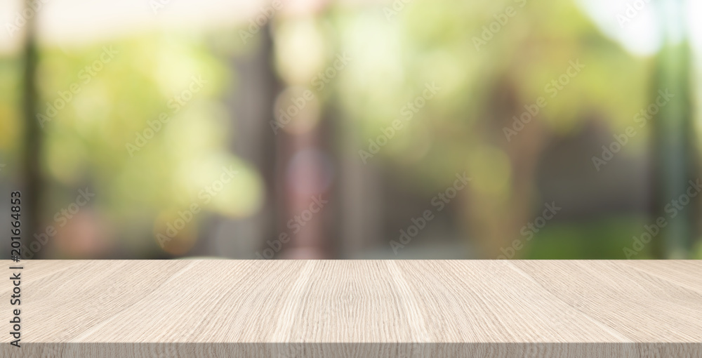 Empty wood table top on garden blurred background , space for montage show product Empty wood table top on garden blurred background , space for montage show product