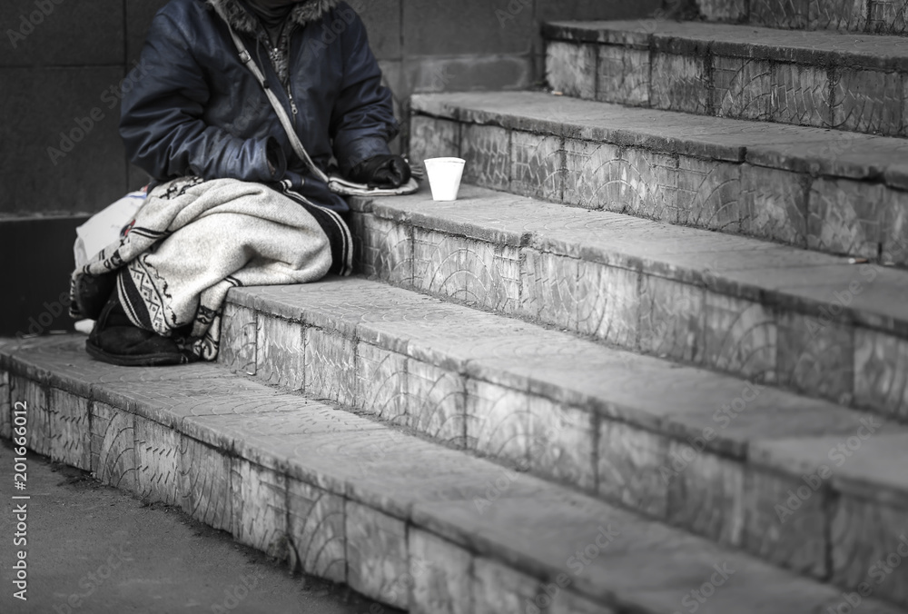 Homeless poor woman begging for money outdoors Homeless poor woman begging for money outdoors