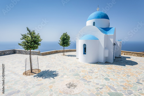 Obraz na płótnie Holy greek white blue chruch chapel of agios theologos sant john shining above the village Nikia over the greek sea on the edge of a volcano on the island of Nisyros, Kos, Dodecanese, Greece w salonie