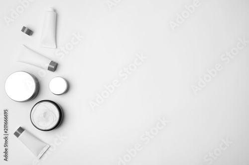 Flat lay composition with cosmetic products on light background