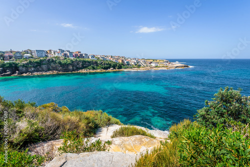 Sunny beautiful summer coast view to Sydney beach and blue Tasman Sea wild wave water and sandy white beaches perfect for surfing swimming hiking, Coogee to Bondi Walk, NSW/ Australia - 10 11 2017