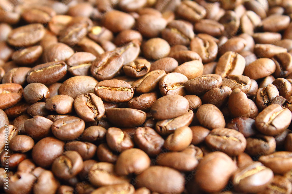 Coffee natural fried in arabica beans. Close-up. Background. Coffee natural fried in arabica beans. Close-up. Background.