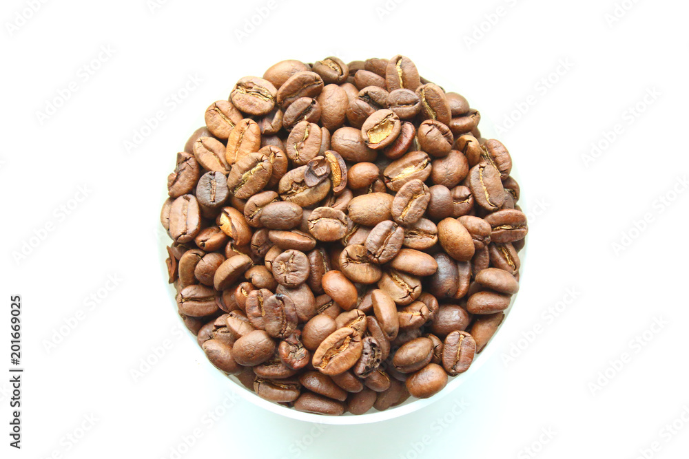 Coffee natural roasted in arabica beans in a bowl. Isolated on white background. Close-up. Coffee natural roasted in arabica beans in a bowl. Isolated on white background. Close-up.