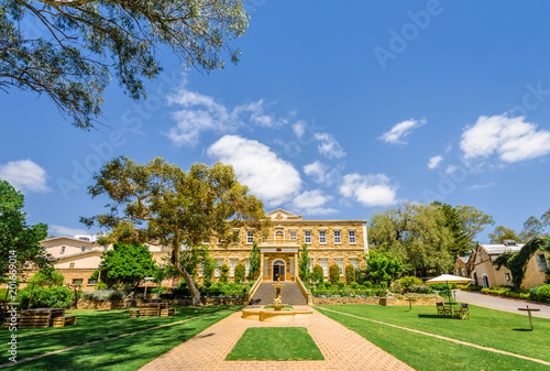 Wonderful green spring summer view to an old vineyard building situated in wine grape valley of the great ocean road with golden well  Barossa Valley  Chateau Yaldara  South  Australia - 10 19 2017