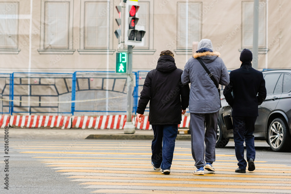 Obraz premium Moscow, Russia - April, 2, 2018: image of Pedestrians cross the road