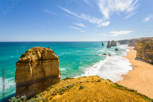 Bright sunny summer coast view to the wild Bass Strait, rocky erosion cliffs of the Great Ocean Road sandstone limestone formation 12 Twelve Apostels, Melbourne, Port Campbell National Park, Australia photo