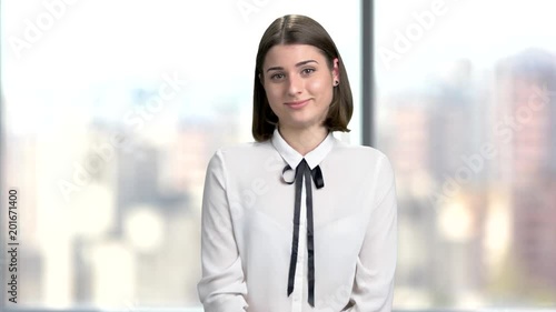 Wallpaper Mural Young woman speaking at business meeting. Young confident business lady talking and looking at camera. Pretty caucasian manager. Torontodigital.ca