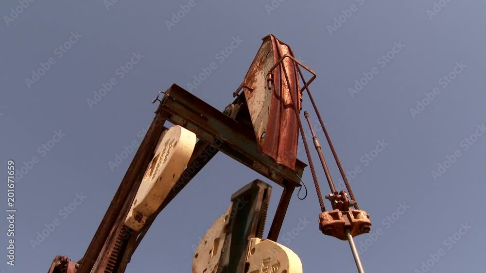 4K UHD Ground proximity shot of pumpjack pumping oil 4K UHD Ground proximity shot of pumpjack pumping oil