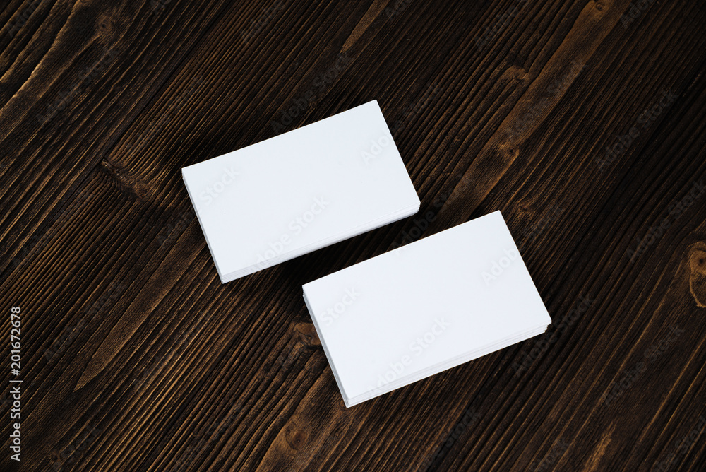Blank business cards on wooden working table with copy space for add text ID. and logo, business company concept. Blank business cards on wooden working table with copy space for add text ID. and logo, business company concept.