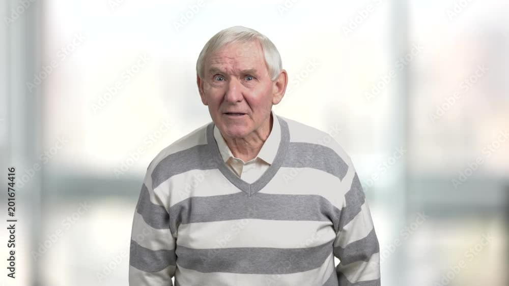 Angry older man arguing and pointing with finger. Senior man expresses his dissatisfaction, blurred background. Pensioner defends his rights. Angry older man arguing and pointing with finger. Senior man expresses his dissatisfaction, blurred background. Pensioner defends his rights.