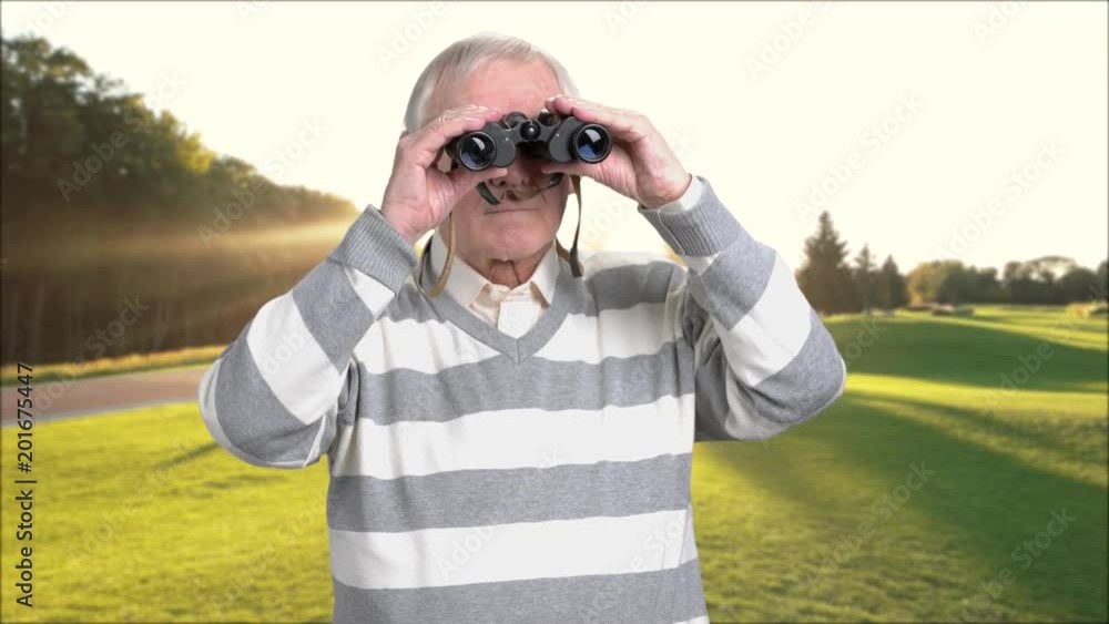 Retired man with binoculars outdoors. Senior man looking through binoculars and enjoying beautiful landscape. Preparing for happy retirement. Retired man with binoculars outdoors. Senior man looking through binoculars and enjoying beautiful landscape. Preparing for happy retirement.