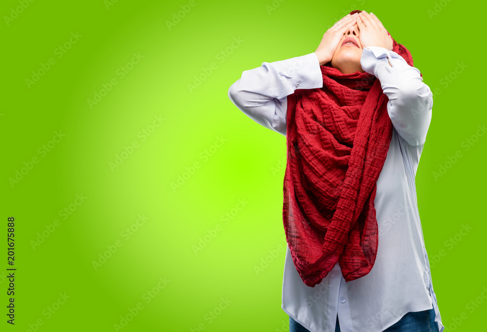 Young arab woman wearing hijab stressful keeping hands on head, tired and frustrated Young arab woman wearing hijab stressful keeping hands on head, tired and frustrated