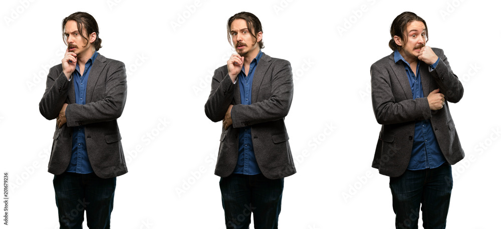 Handsome young man scared in shock, expressing panic and fear Handsome young man scared in shock, expressing panic and fear