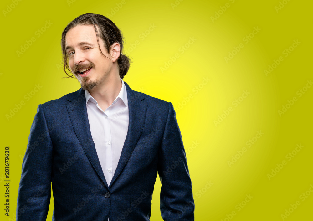 Handsome young man confident and happy with a big natural smile laughing Handsome young man confident and happy with a big natural smile laughing