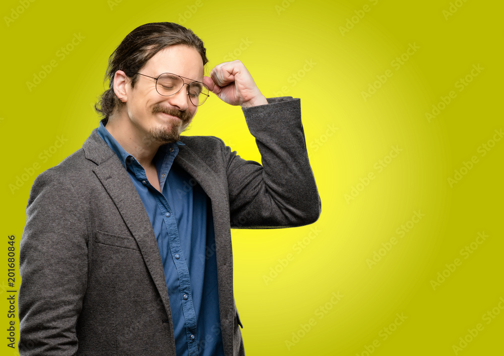 Handsome young man happy and excited celebrating victory expressing big success, power, energy and positive emotions. Celebrates new job joyful Handsome young man happy and excited celebrating victory expressing big success, power, energy and positive emotions. Celebrates new job joyful