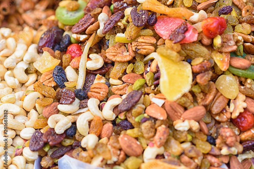 Healthy food background. Sweet energy dry fruits and nuts mix. Selective focus. Healthy food background. Sweet energy dry fruits and nuts mix. Selective focus.