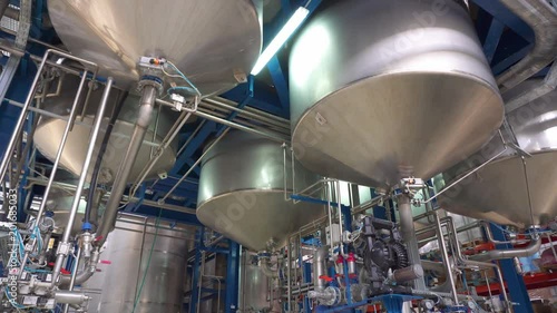 Manufacture of paint, paint mixing tanks. Shooting dolly slide camera motion.