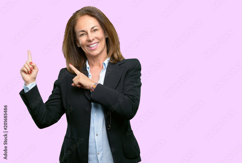 Middle age business woman pointing away side with his finger Middle age business woman pointing away side with his finger