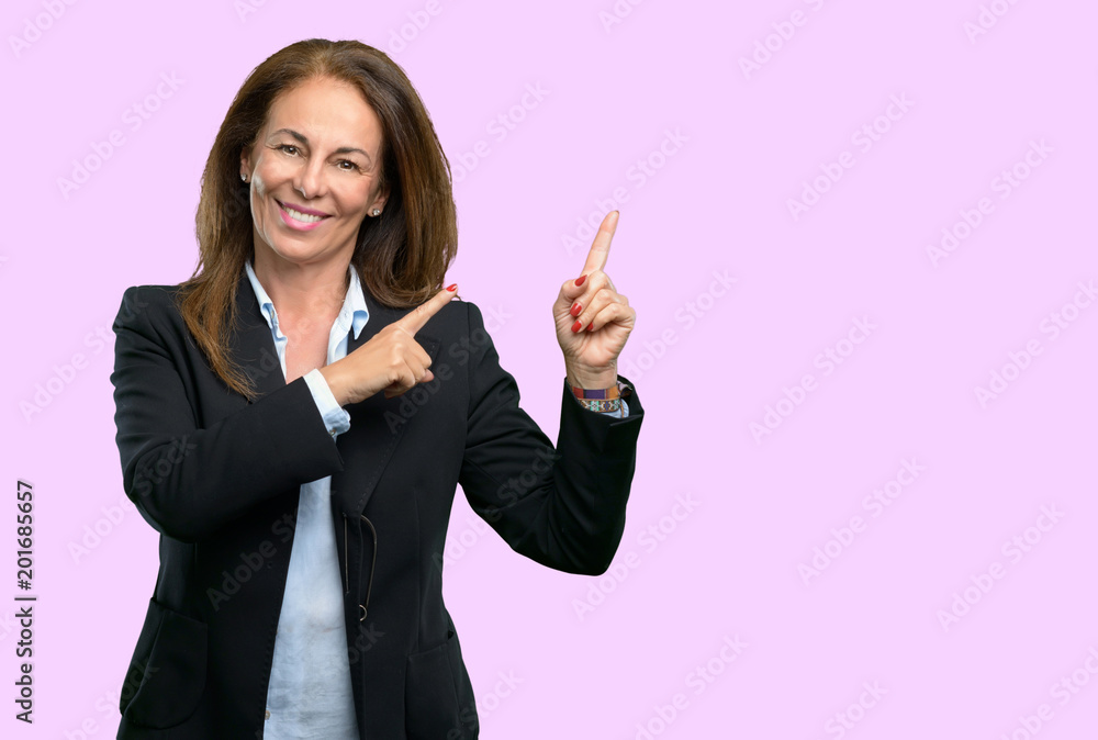 Middle age business woman pointing away side with fingers Middle age business woman pointing away side with fingers