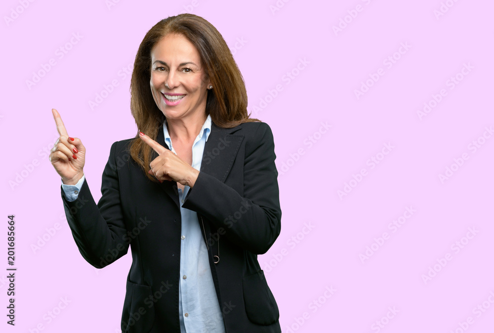 Middle age business woman pointing away side with fingers Middle age business woman pointing away side with fingers