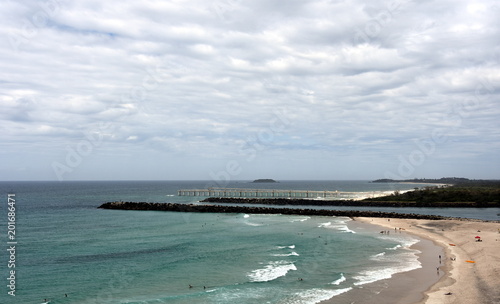 Duranbah beach and breakwall at the entrance of Tweed River on a cloudy day. Duranbah Beach  officially known as Flagstaff beach is the most northern beach in New South Wales.