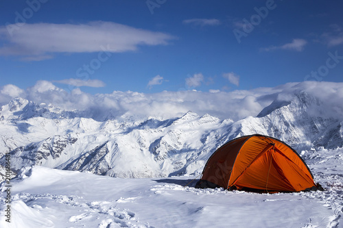 orange tent against the mountains © Екатерина Васильева