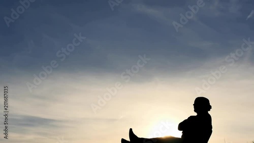 Relaxed man body profile silhouette vertical dolly shot time lapse photo