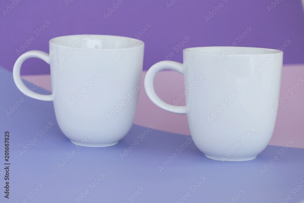 Minimalist cup Mockup.white cups on a  graphic background . cup on trend lilac pink geometric background. copy space.tableware mockup.