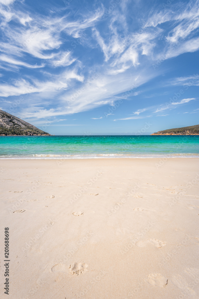 Relaxing amazing view to stunning sandy beach blue turqouise water enjoy swiming warm sunny day with blue sky after hiking on top mountains, Freycinet National Park, Wineglass Bay, Tasmania, Australia Relaxing amazing view to stunning sandy beach blue turqouise water enjoy swiming warm sunny day with blue sky after hiking on top mountains, Freycinet National Park, Wineglass Bay, Tasmania, Australia