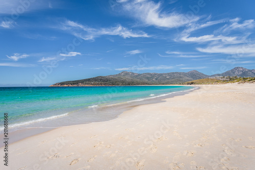 Relaxing amazing view to stunning sandy beach blue turqouise water enjoy swiming warm sunny day with blue sky after hiking on top mountains, Freycinet National Park, Wineglass Bay, Tasmania, Australia © Thomas Jastram
