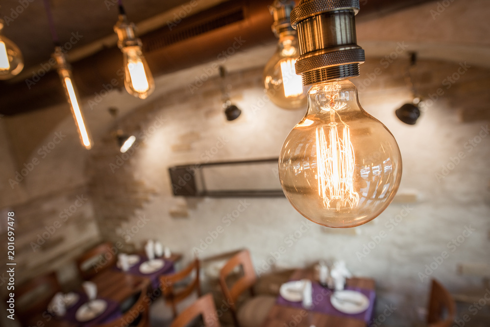 Obraz premium Old vintage chandelier in restaurant interior
