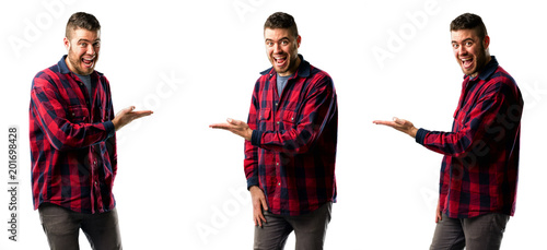 Young man holding something in his empty hand isolated over white background, collage composition
