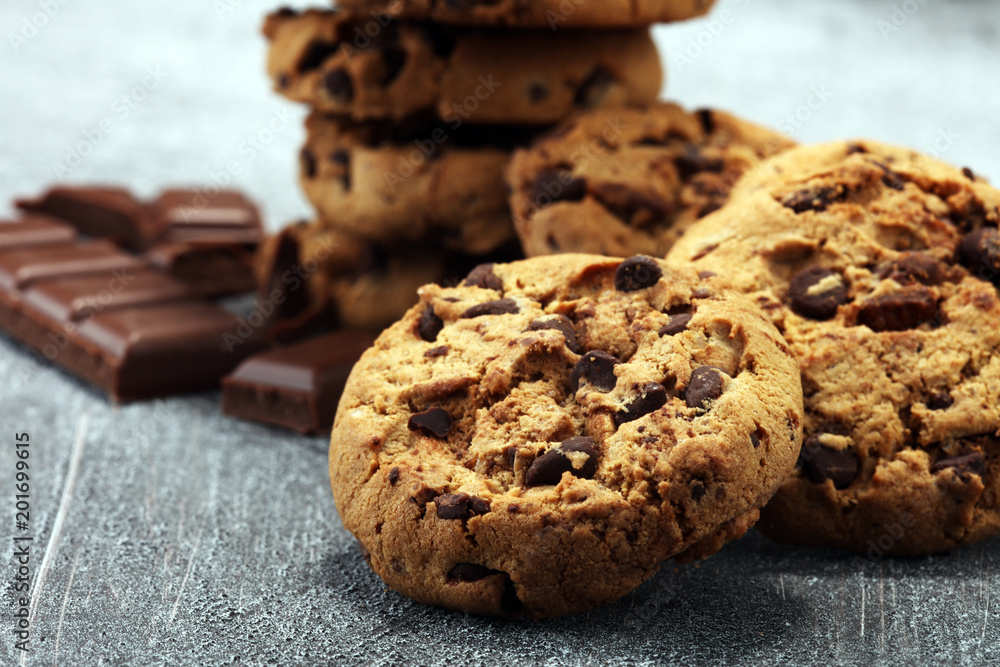 Fototapeta premium Chocolate cookies on rustic table. Chocolate chip cookies