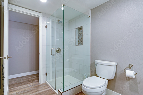 Elegant bathroom with hardwood floor.