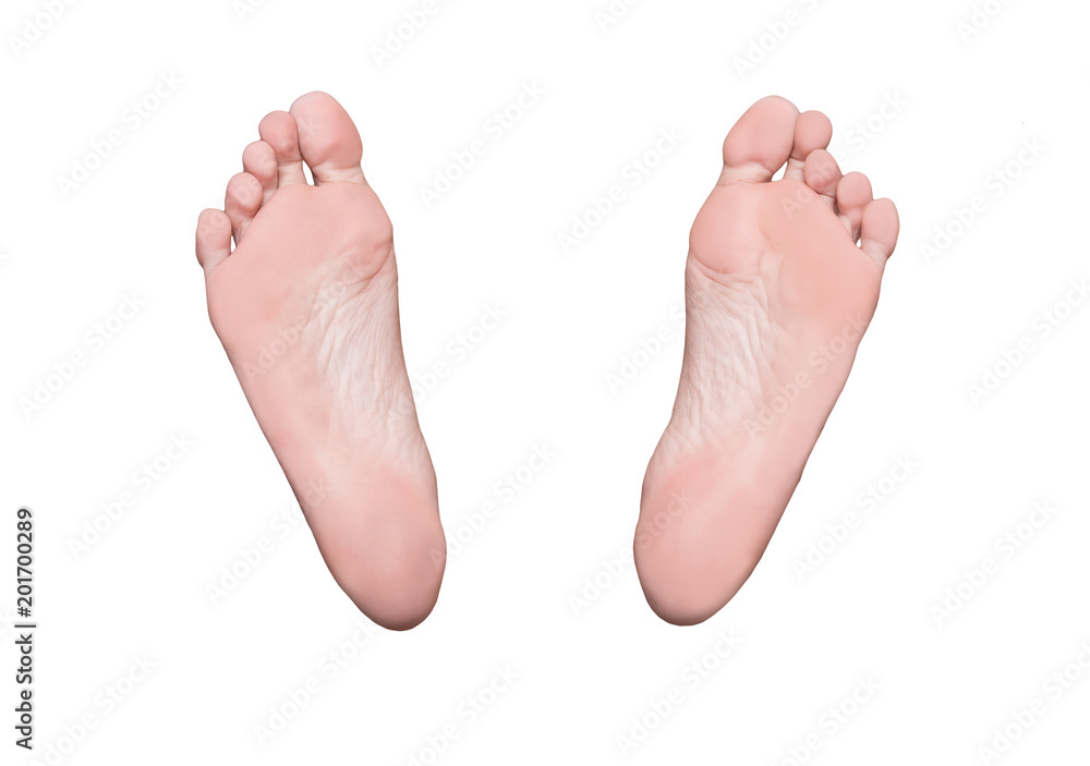 Left and right foot soles, female feet, medical or massage concept Left and right foot soles, female feet, medical or massage concept